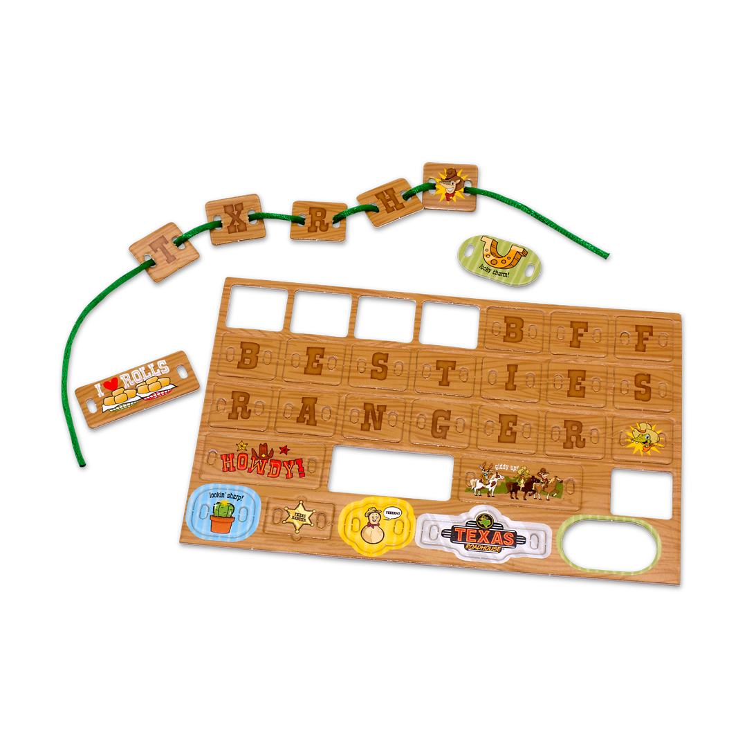 A bracelet-making kit consisting of a wooden-textured punch-out sheet with letter tiles and illustrated charms, accompanied by a green string for threading.