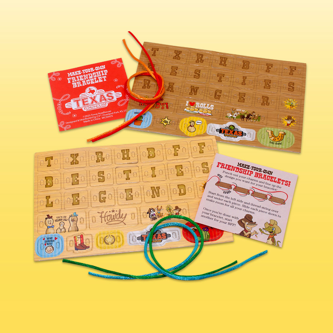A bracelet-making kit consisting of a wooden-textured punch-out sheet with letter tiles and illustrated charms, accompanied by a green string for threading.